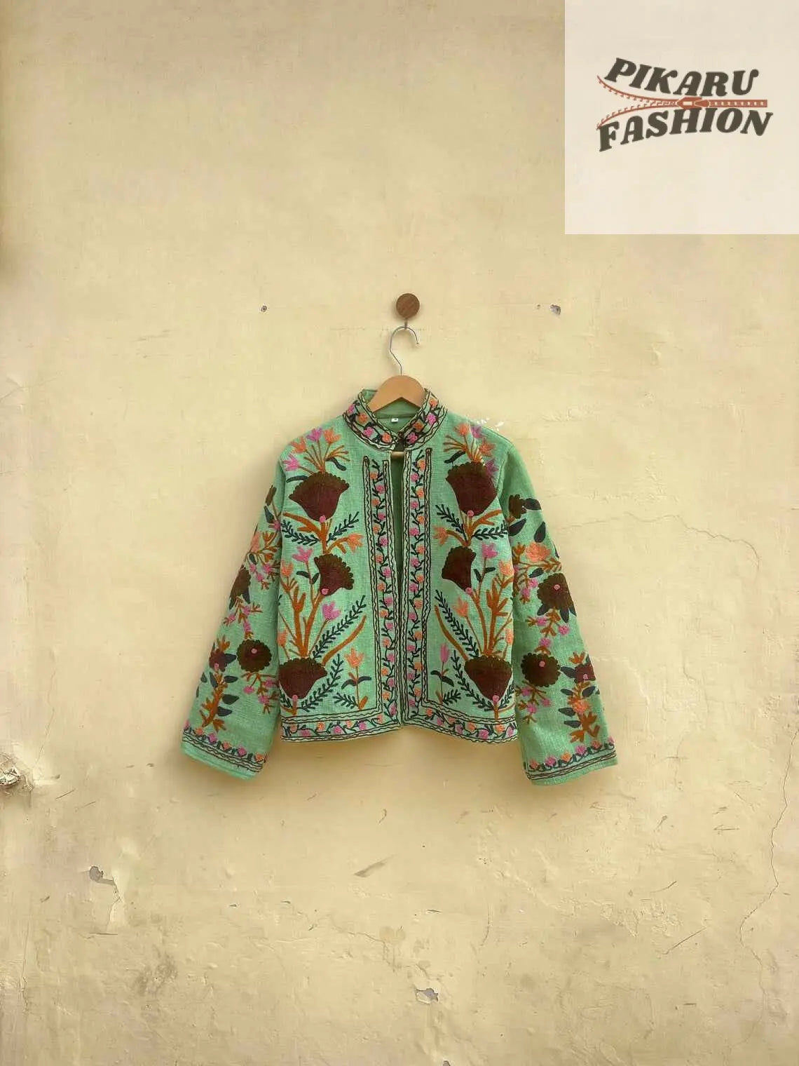 Suzani Embroidered Jacket with vibrant floral motifs, showcasing boho style and artisan craftsmanship.