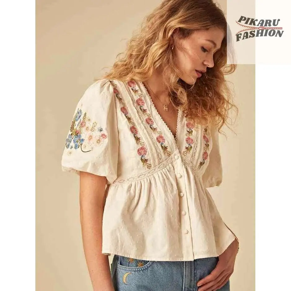  Embroidered Puff Sleeve Top – model sitting with clutch