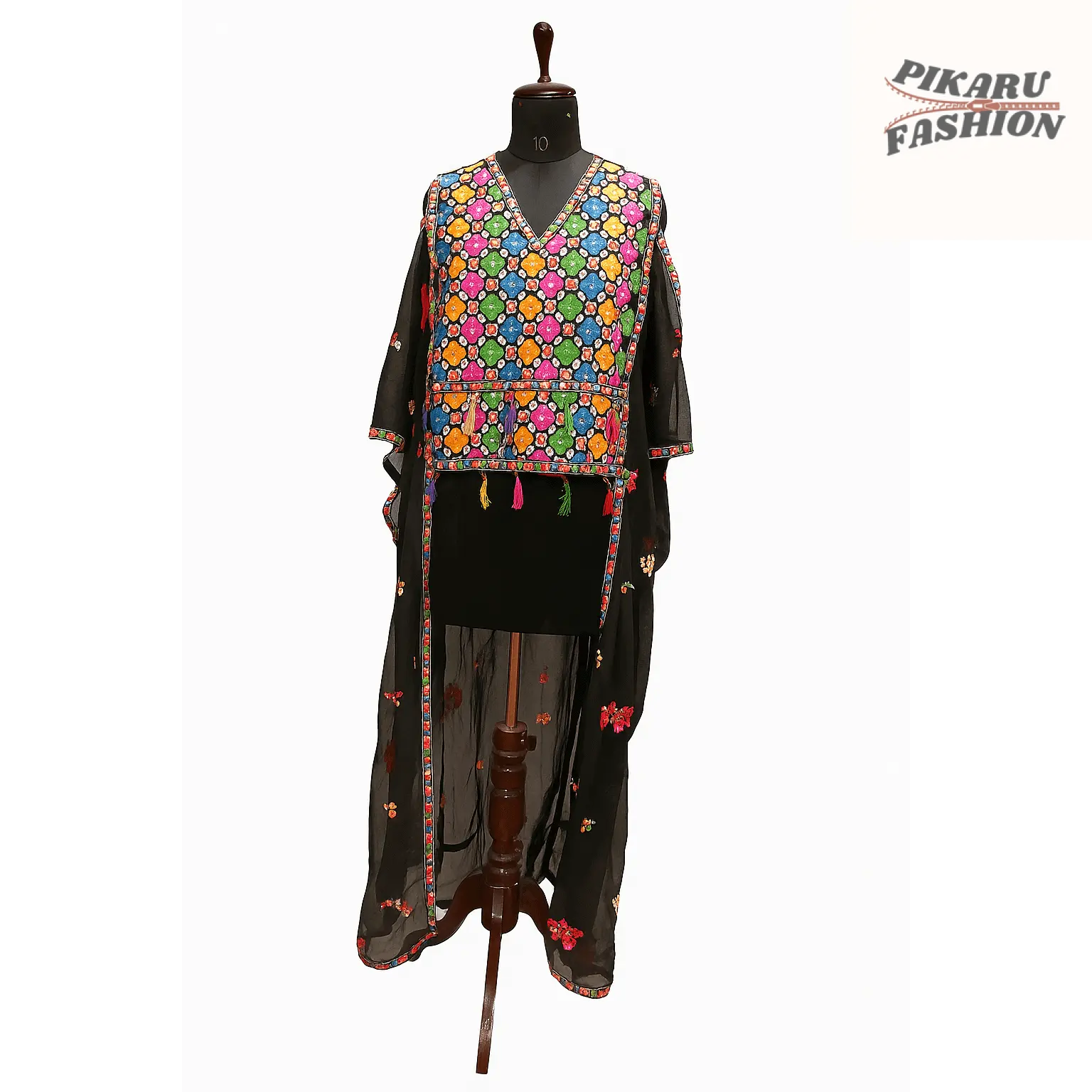 Stylish chiffon embroidery jumpsuit with fringe displayed on a mannequin showcasing intricate patterns and vibrant colors.