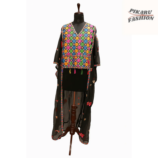 Stylish chiffon embroidery jumpsuit with fringe displayed on a mannequin showcasing intricate patterns and vibrant colors.