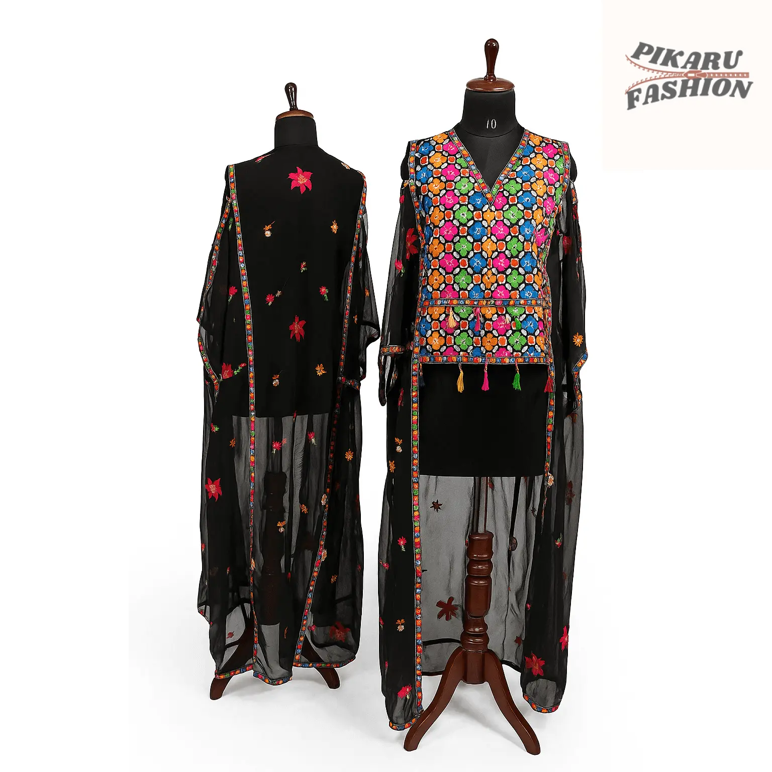 Chiffon embroidery jumpsuit with fringe displayed on a mannequin showcasing vibrant floral embroidery and tassel details.